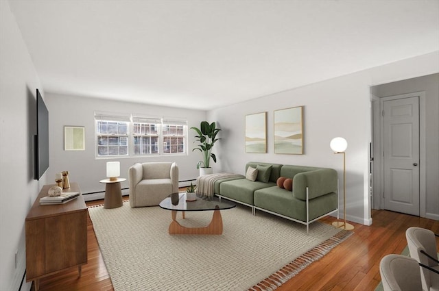 living room with baseboard heating and hardwood / wood-style floors