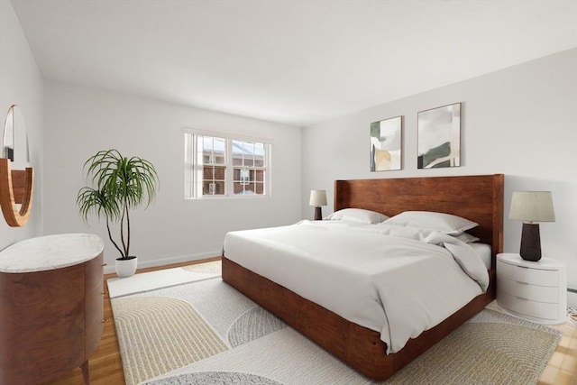 bedroom with light hardwood / wood-style floors