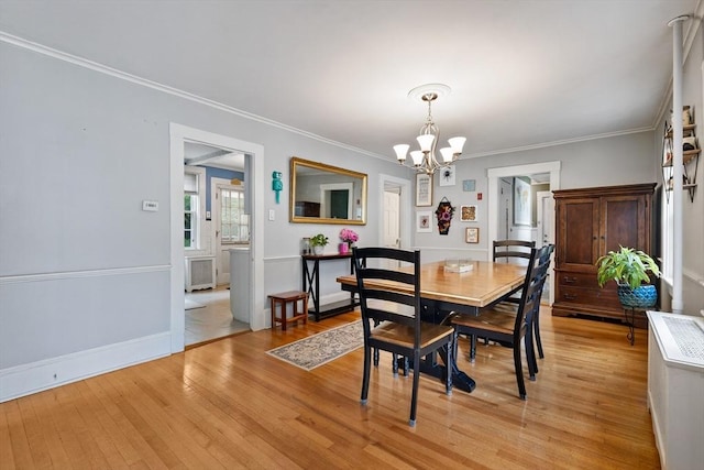 60 Brookfield Rd, Sturbridge, MA 01518 - dining area featuring a chandelier, light wood finished floors, and crown molding