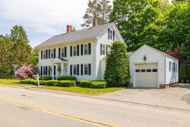 60 Brookfield Rd, Sturbridge, MA 01518 - colonial inspired home featuring an outdoor structure, a chimney, a garage, and asphalt driveway