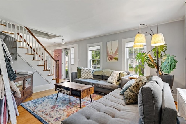 60 Brookfield Rd, Sturbridge, MA 01518 - living room with wood finished floors, stairway, and crown molding
