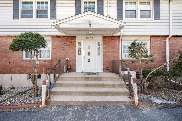 entrance to property with brick siding