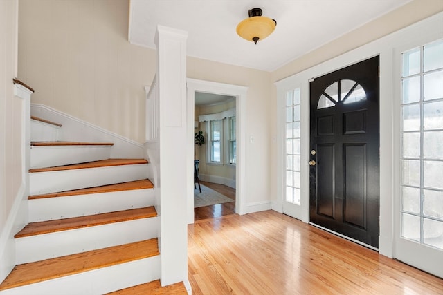 entryway with plenty of natural light and hardwood / wood-style flooring