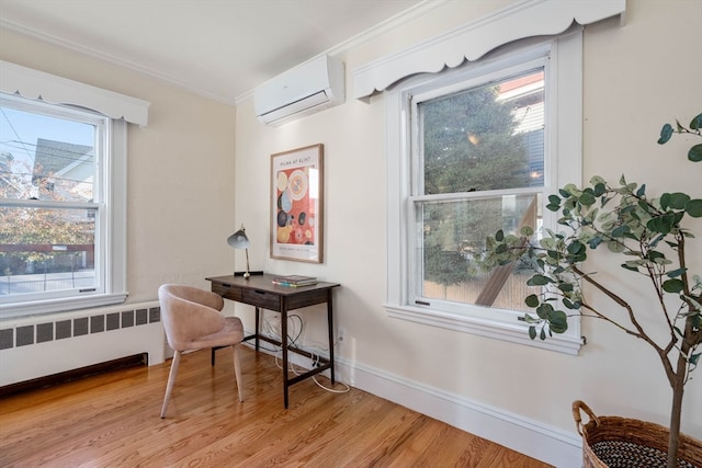 office space featuring radiator, light hardwood / wood-style floors, a wall mounted AC, and crown molding