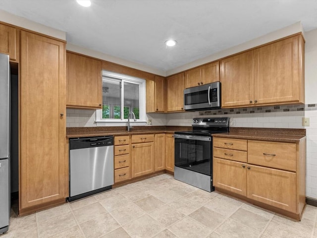 182 W Main St, Westborough, MA 01581 - kitchen with stainless steel appliances, dark countertops, tasteful backsplash, and recessed lighting