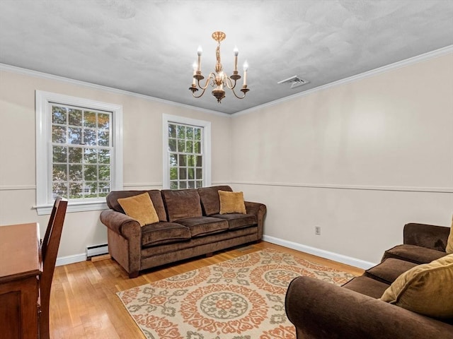 182 W Main St, Westborough, MA 01581 - living room featuring a chandelier, hardwood / wood-style flooring, a baseboard heating unit, crown molding, and baseboards