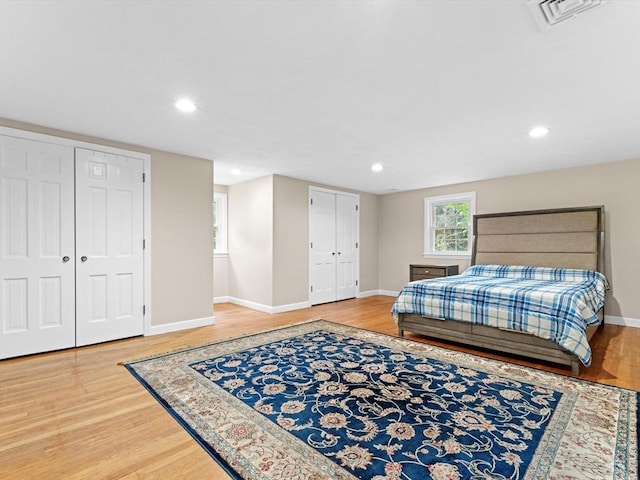 182 W Main St, Westborough, MA 01581 - bedroom with wood finished floors, baseboards, recessed lighting, and multiple closets