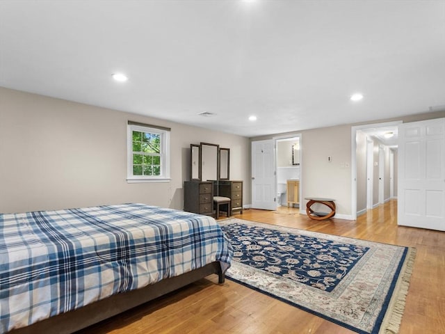 182 W Main St, Westborough, MA 01581 - bedroom with wood finished floors, recessed lighting, and baseboards