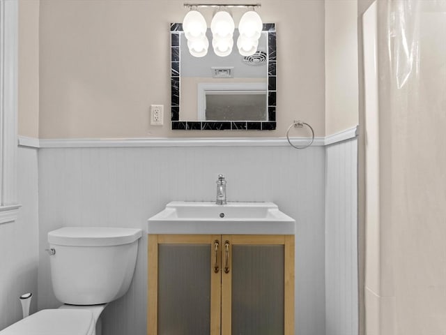 182 W Main St, Westborough, MA 01581 - bathroom featuring wainscoting, toilet, and vanity