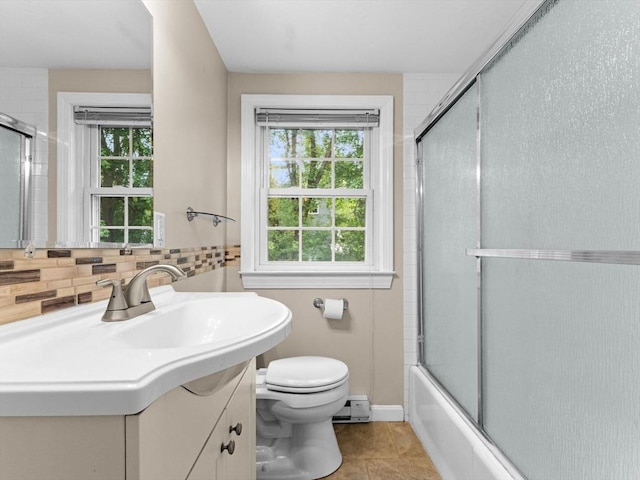 182 W Main St, Westborough, MA 01581 - bathroom with toilet, vanity, shower / bath combination with glass door, tasteful backsplash, and baseboard heating