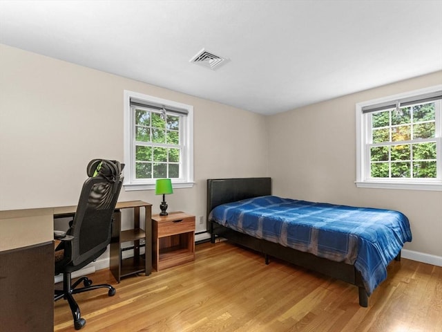 182 W Main St, Westborough, MA 01581 - bedroom featuring light wood-type flooring, a desk, and baseboards