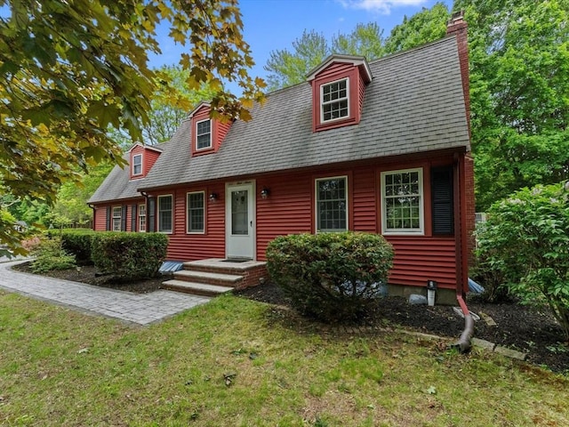 182 W Main St, Westborough, MA 01581 - new england style home with a front yard and a chimney