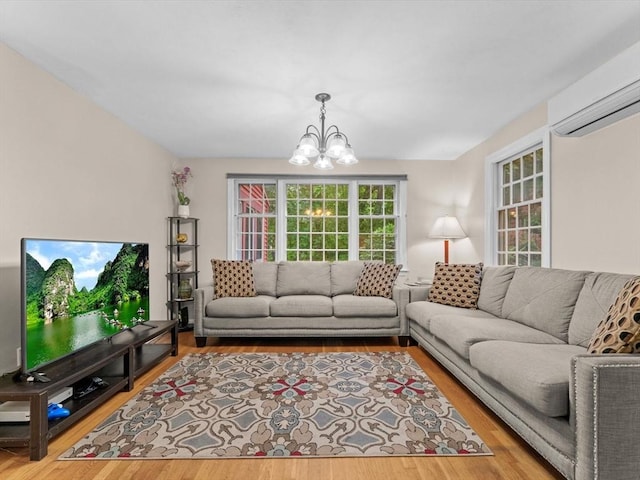 182 W Main St, Westborough, MA 01581 - living room with a wall mounted air conditioner, a chandelier, and wood finished floors