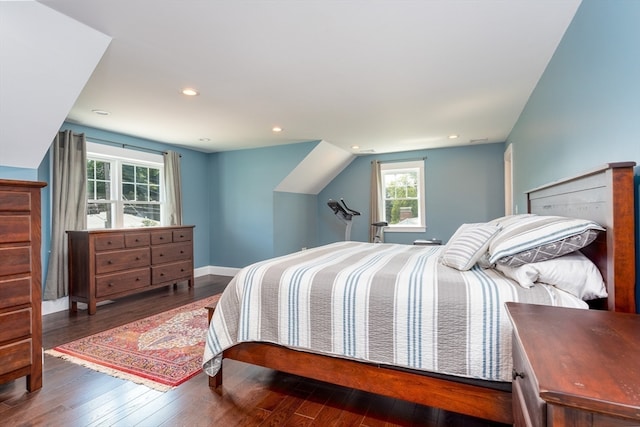 bedroom featuring dark hardwood / wood-style flooring and vaulted ceiling