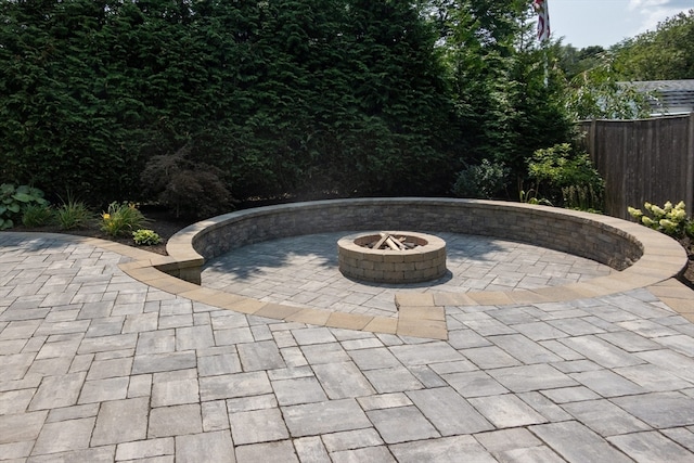 view of patio with an outdoor fire pit