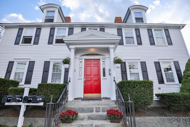 multi unit property featuring a chimney
