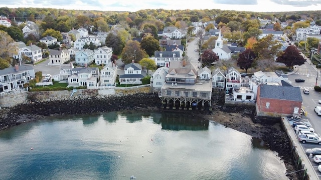 bird's eye view with a water view and a residential view