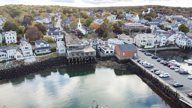 bird's eye view with a water view and a residential view