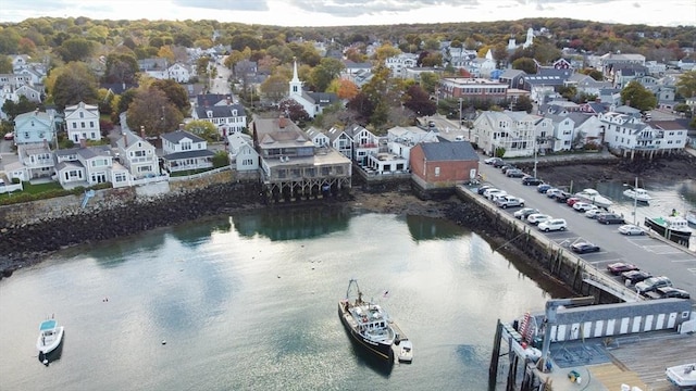 aerial view with a water view and a residential view