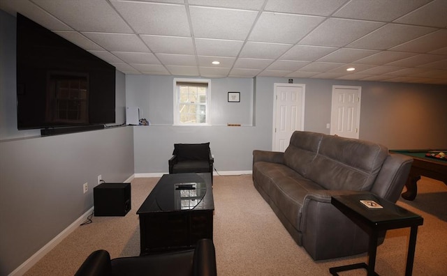 living room with recessed lighting, carpet flooring, a drop ceiling, and baseboards