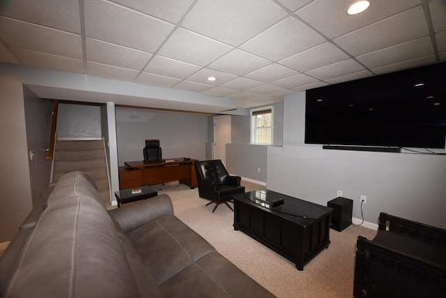 living room with carpet flooring, a paneled ceiling, and baseboards