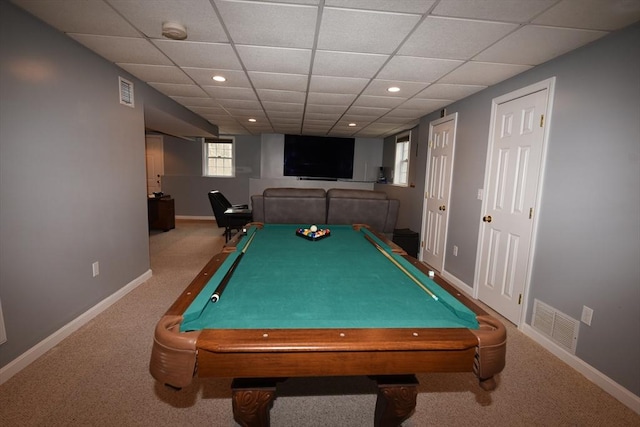 recreation room with carpet, visible vents, and baseboards