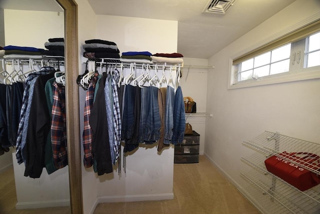 walk in closet with carpet floors and visible vents