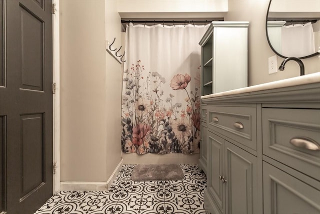 70 Oak St, Norton, MA 02766 - full bath featuring vanity, tile patterned flooring, and curtained shower