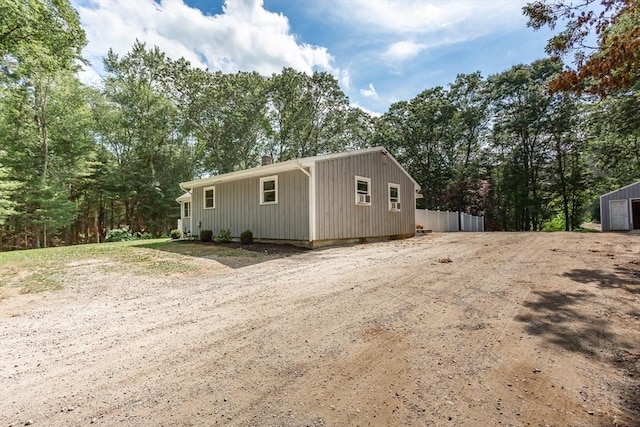 70 Oak St, Norton, MA 02766 - view of side of property with a chimney