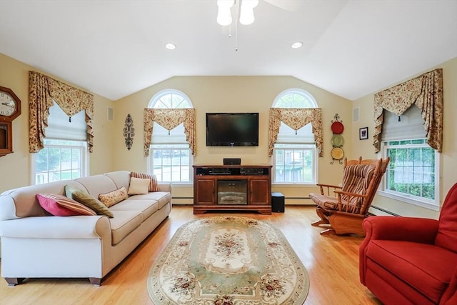 80 Summer St, Walpole, MA 02071 - living area with plenty of natural light, a ceiling fan, a baseboard heating unit, and vaulted ceiling
