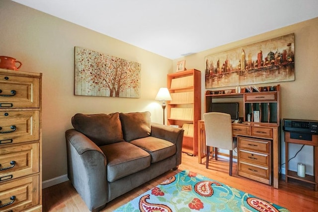 80 Summer St, Walpole, MA 02071 - living area with light wood finished floors and a desk