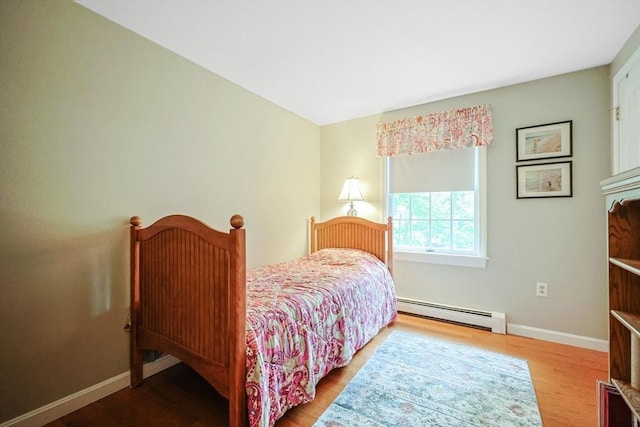 80 Summer St, Walpole, MA 02071 - bedroom with baseboard heating, wood finished floors, and baseboards