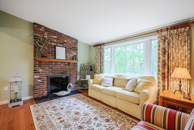 80 Summer St, Walpole, MA 02071 - living room featuring wood-type flooring, a brick fireplace, baseboards, and lofted ceiling