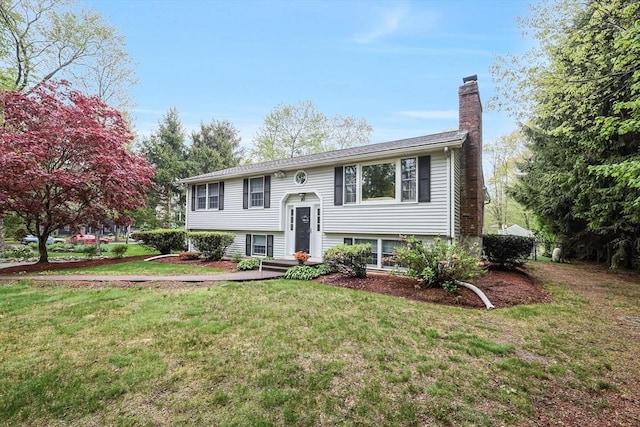 80 Summer St, Walpole, MA 02071 - raised ranch with a chimney and a front lawn