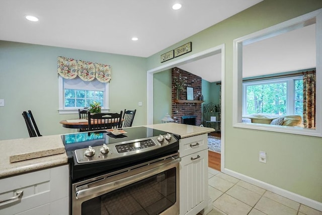 80 Summer St, Walpole, MA 02071 - kitchen featuring stainless steel range with electric cooktop, plenty of natural light, white cabinetry, light countertops, and recessed lighting