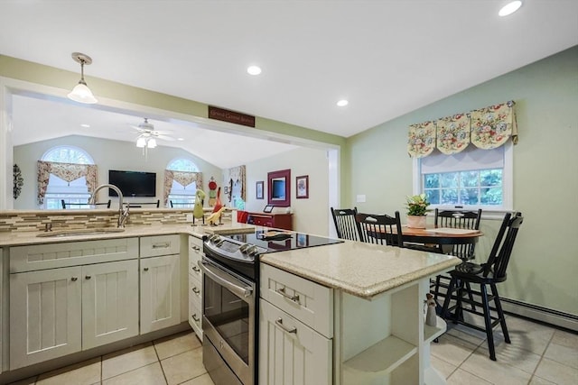 80 Summer St, Walpole, MA 02071 - kitchen featuring stainless steel electric stove, a sink, lofted ceiling, light tile patterned floors, and healthy amount of natural light