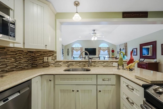 80 Summer St, Walpole, MA 02071 - kitchen with a sink, stainless steel appliances, a ceiling fan, lofted ceiling, and decorative backsplash