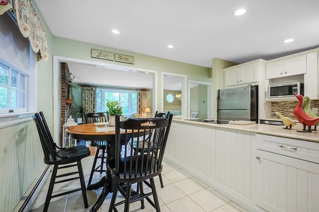 80 Summer St, Walpole, MA 02071 - kitchen with appliances with stainless steel finishes, light countertops, white cabinetry, light tile patterned flooring, and recessed lighting