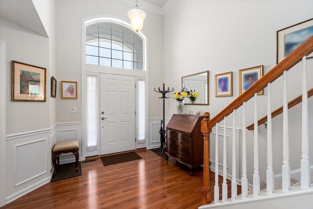 8 Heartwood Way Unit 8, Hopkinton, MA 01748 - foyer entrance with wood finished floors, a decorative wall, wainscoting, crown molding, and stairs