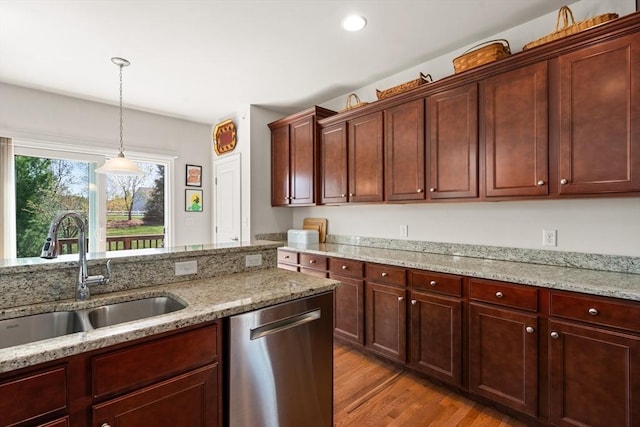 8 Heartwood Way Unit 8, Hopkinton, MA 01748 - kitchen featuring stainless steel dishwasher, a sink, light wood-type flooring, decorative light fixtures, and light stone countertops