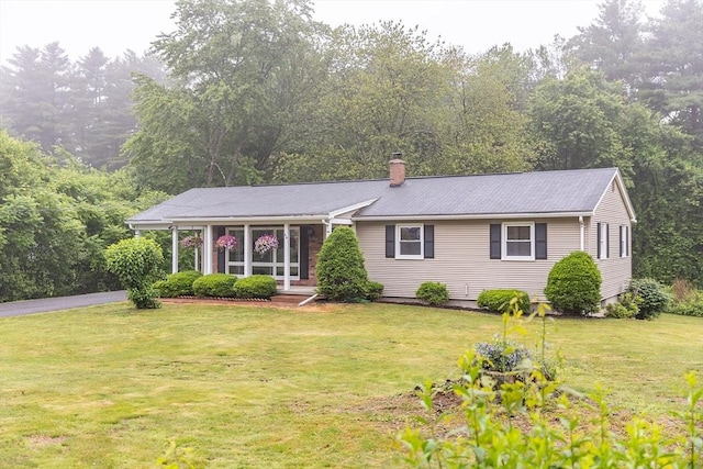59 Mountain Rd, Holyoke, MA 01040 - ranch-style house featuring a front lawn and a chimney