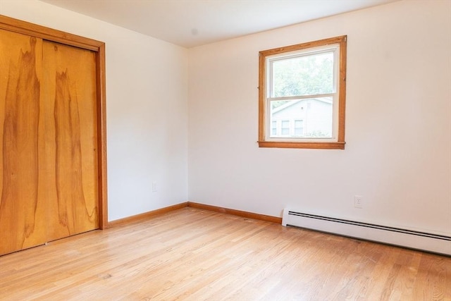 59 Mountain Rd, Holyoke, MA 01040 - empty room featuring a baseboard radiator and light wood-style flooring