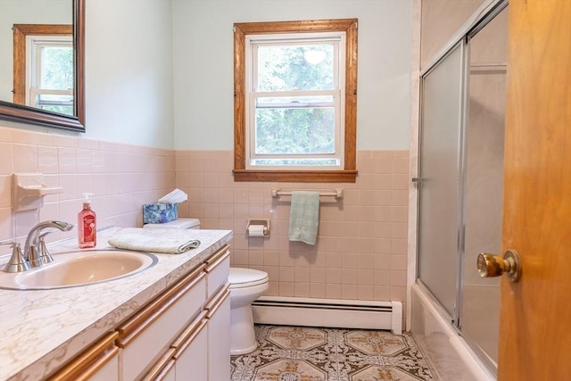 59 Mountain Rd, Holyoke, MA 01040 - full bath with a baseboard radiator, tile patterned floors, plenty of natural light, tile walls, and vanity