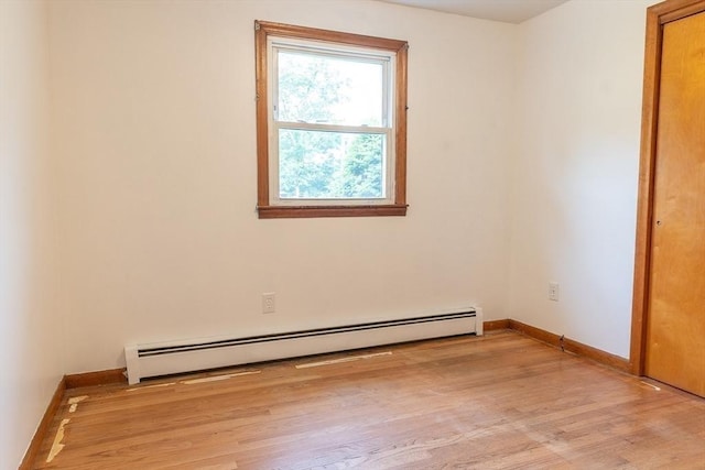 59 Mountain Rd, Holyoke, MA 01040 - spare room featuring a baseboard radiator and light wood-type flooring