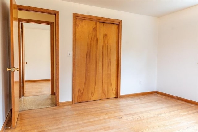 59 Mountain Rd, Holyoke, MA 01040 - unfurnished bedroom with light wood-style flooring and a closet