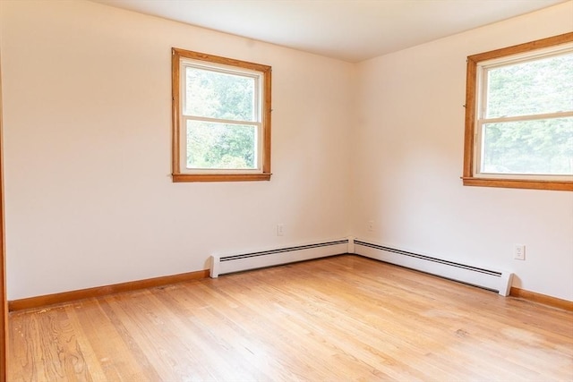 59 Mountain Rd, Holyoke, MA 01040 - spare room with a baseboard radiator, healthy amount of natural light, and light wood-type flooring