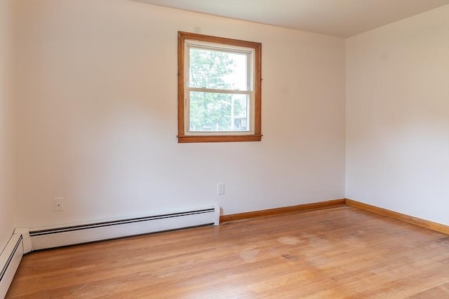 59 Mountain Rd, Holyoke, MA 01040 - empty room with light wood-style flooring and baseboard heating