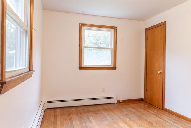 59 Mountain Rd, Holyoke, MA 01040 - unfurnished room with light wood-type flooring and baseboard heating