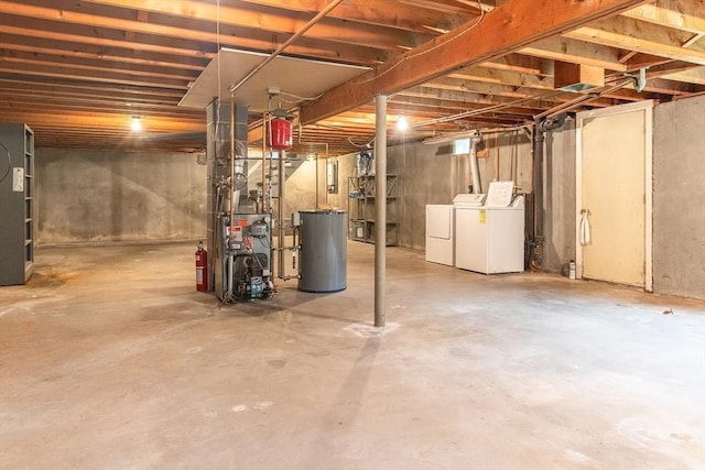 59 Mountain Rd, Holyoke, MA 01040 - unfinished below grade area with washing machine and dryer, a heating unit, and water heater
