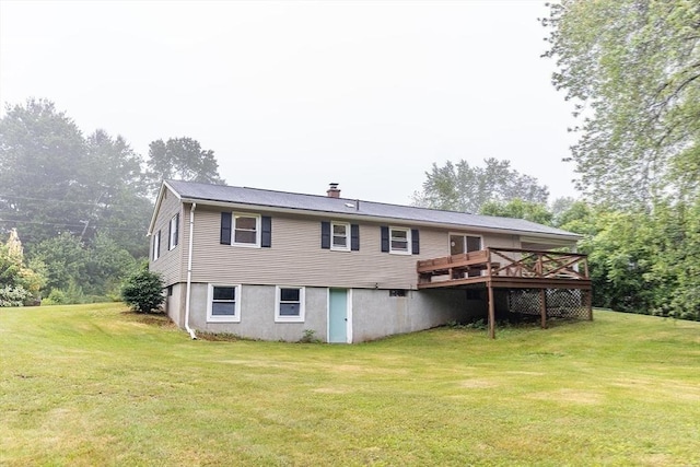 59 Mountain Rd, Holyoke, MA 01040 - back of property featuring a yard, a wooden deck, and a chimney